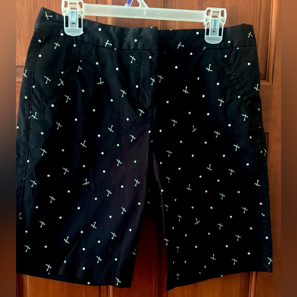 IZOD Black golf shorts with Green and White tees and golf ball Pattern size 8